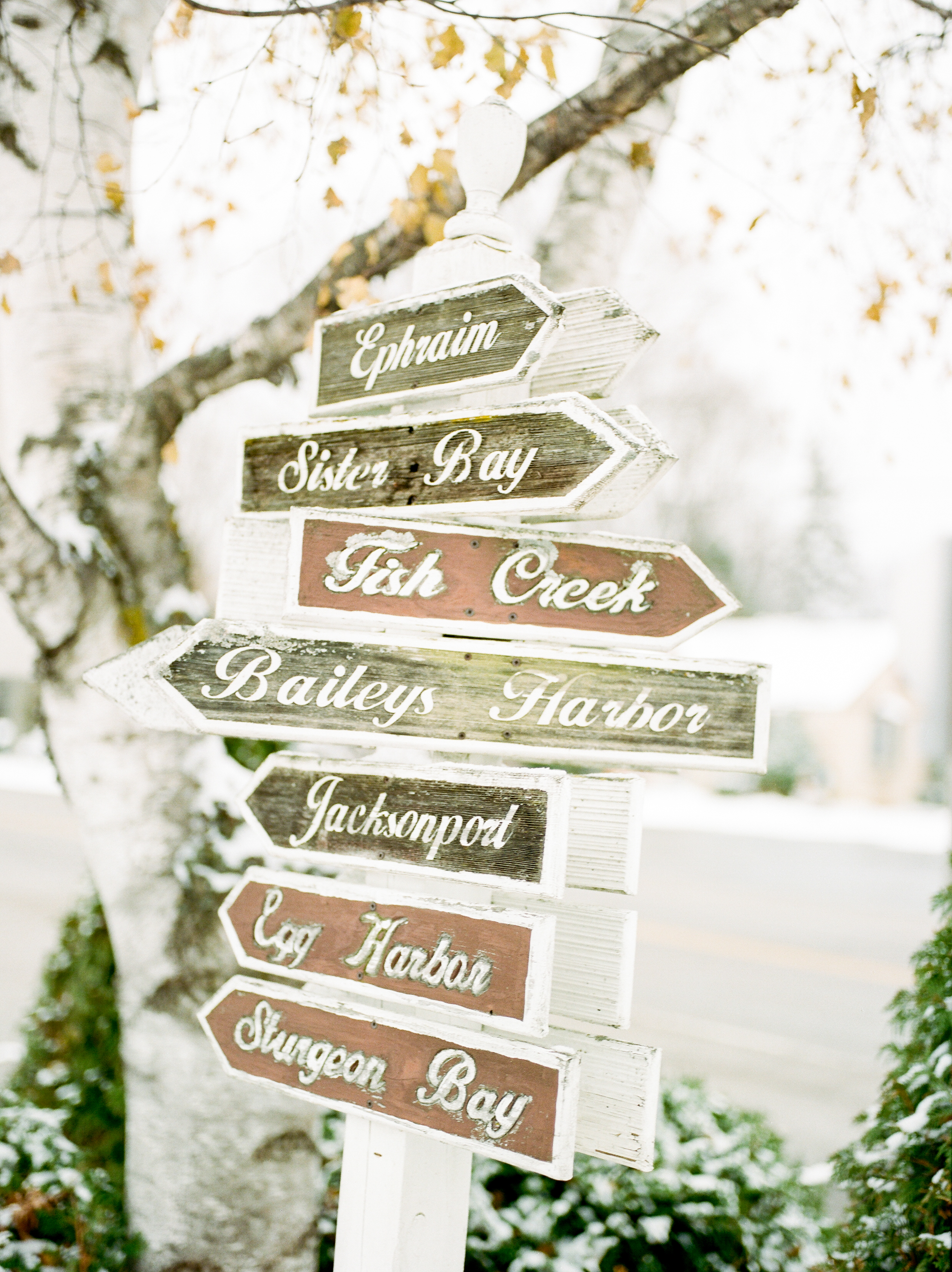 Door County in winter | Photo of a sign displaying the Door County towns of Ephraim, Sister Bay, Fish Creek, Bailey's Harbor, Jacksonport, Egg Harbor and Sturgeon Bay