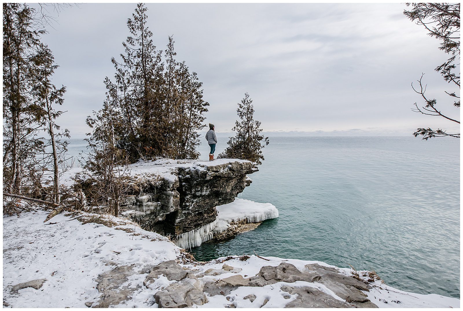 a winter landscape view of Cave Point in Door County, WI