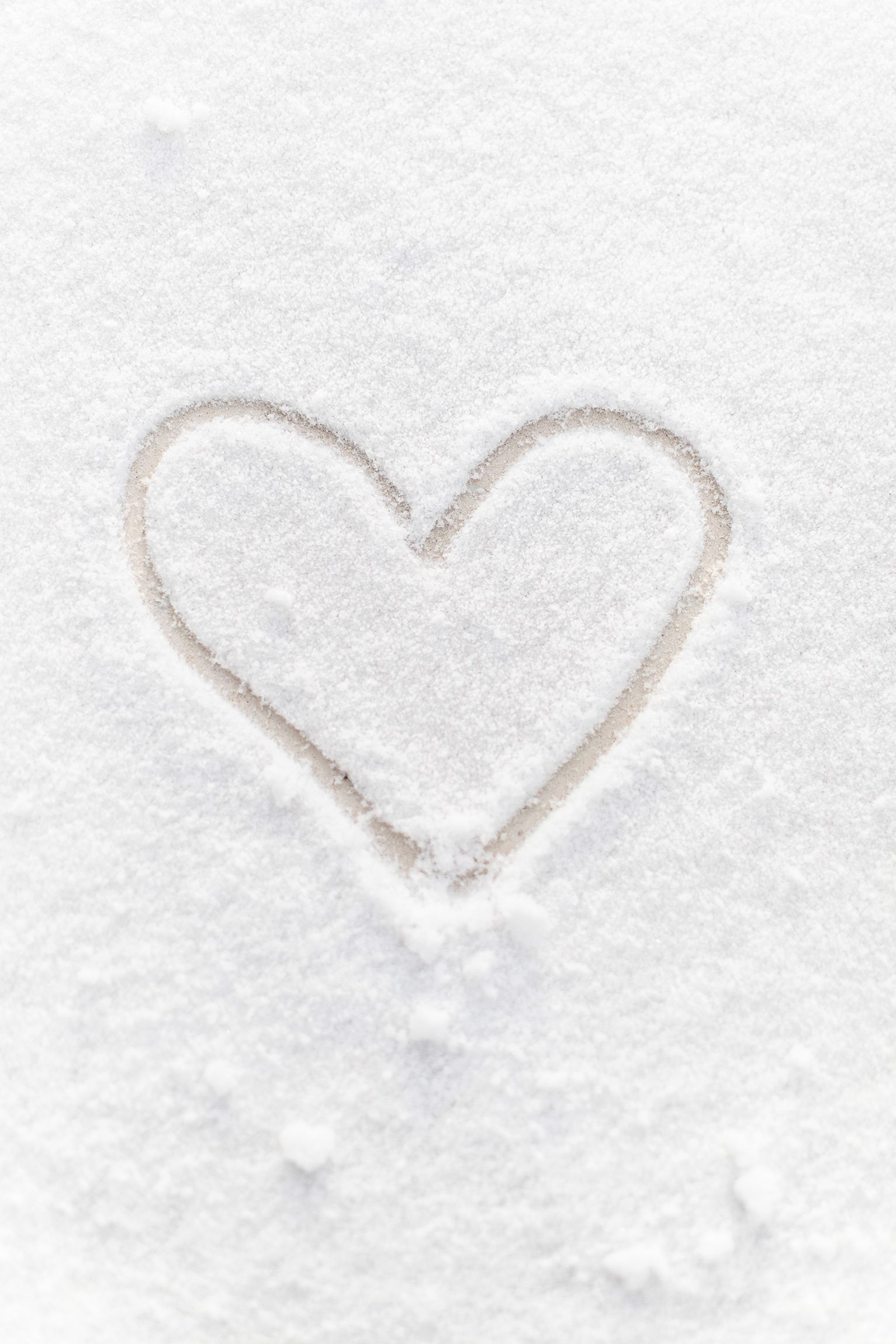 a heart drawn in the snow in the winter in Door County